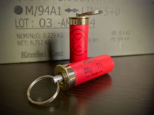 Keyring made from a real 12-gauge shotgun shell cartridge, offering a rugged and distinctive design.