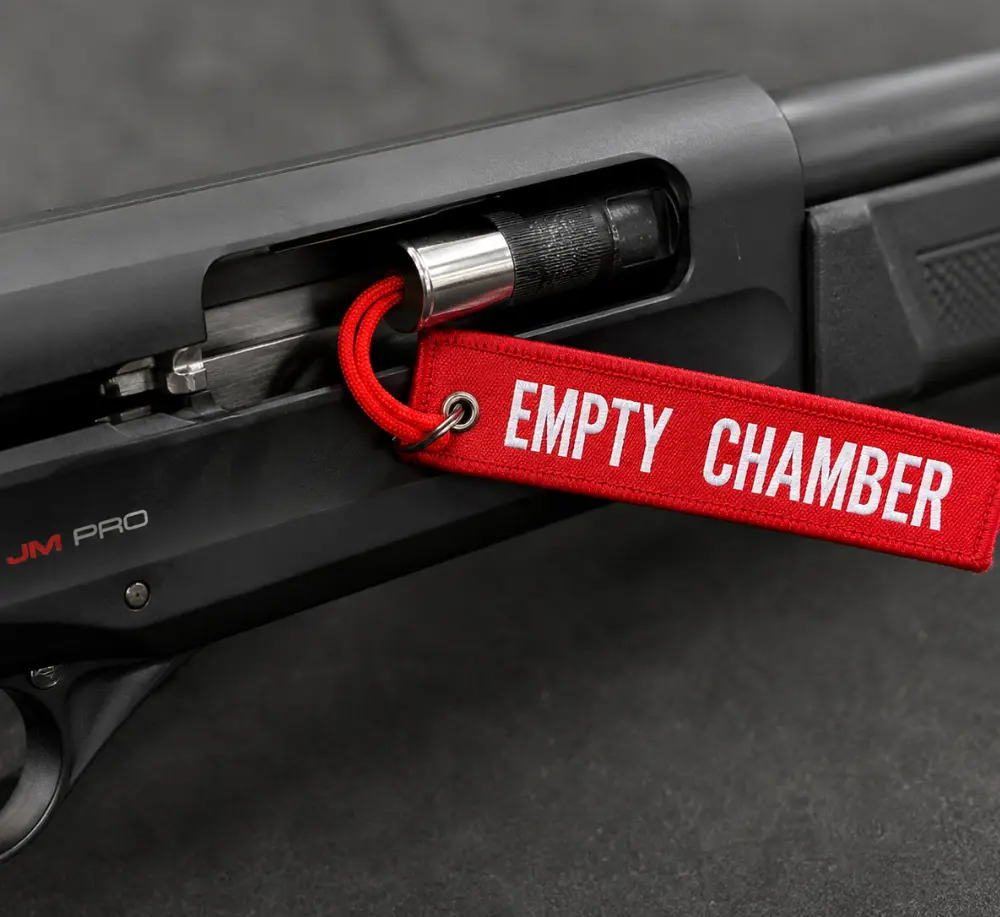 12 Gauge Shotgun Breech Flag - Empty Chamber Safety Flag 12g breech flag shown inserted in shotgun chamber