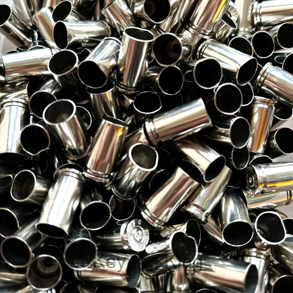 Accessories Nickel plated 9mm bullet casings in a 20-pack, perfect for crafts and resin art projects, showcasing polished finish and authentic marks from once-fired use.