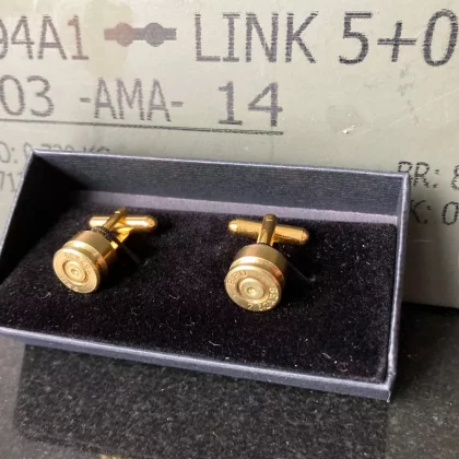 Handcrafted AK-47 bullet cufflinks made from authentic 7.62x39mm casings, featuring a polished brass finish for a bold and unique accessory.