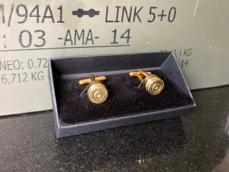 Handcrafted AK-47 bullet cufflinks made from authentic 7.62x39mm casings, featuring a polished brass finish for a bold and unique accessory.