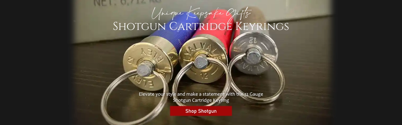 Custom laser-engraved keyring made from a real 12-gauge shotgun cartridge with a polished brass base, perfect for hunting enthusiasts.