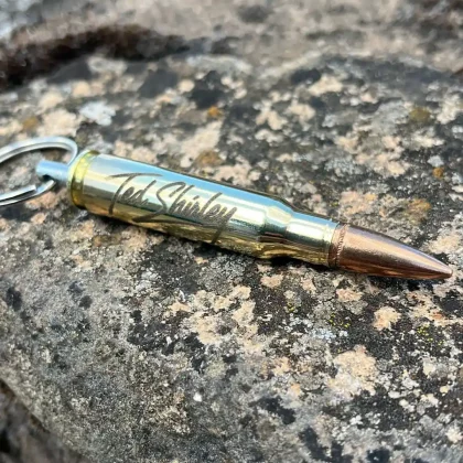 Home Official Ted Shirley 'Afghanistan Sniper' merchandise. Handcrafted 7.62 NATO bullet keyring laser-engraved with his signature.